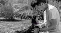 Man holding a dog
