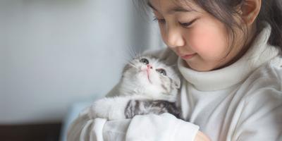A girl with a kitten