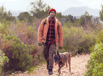 Man hiking with his dog